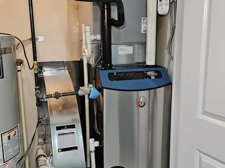 Completed TAK Heating and Cooling installation in a residential mechanical room